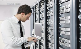 Business man practice yoga at network server room